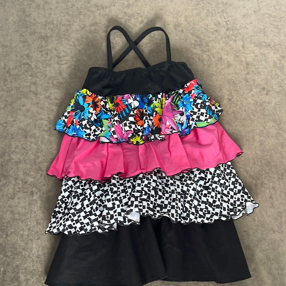 Kellé dance costume. Thin straps with multi design ruffle trim. Size Med child
